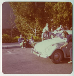 A few members of the Maple Hall crew use Randy Ishihara's Volkswagen for the VW event during Lumberjack Days.